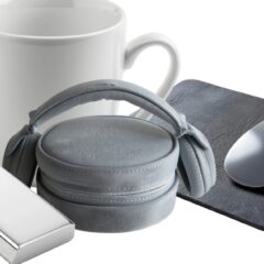 A collection of promotional items ready for custom branding There is a mouse a mug headphones and a keychain